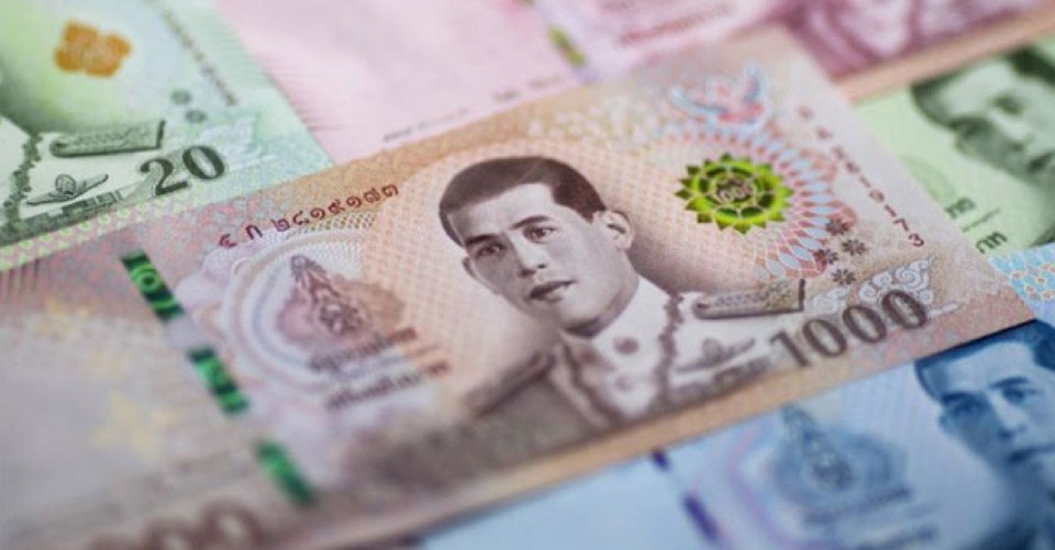 Bảng tỷ giá đổi ngoại tệ tại một điểm giao dịch Baht Thái ở Bangkok.